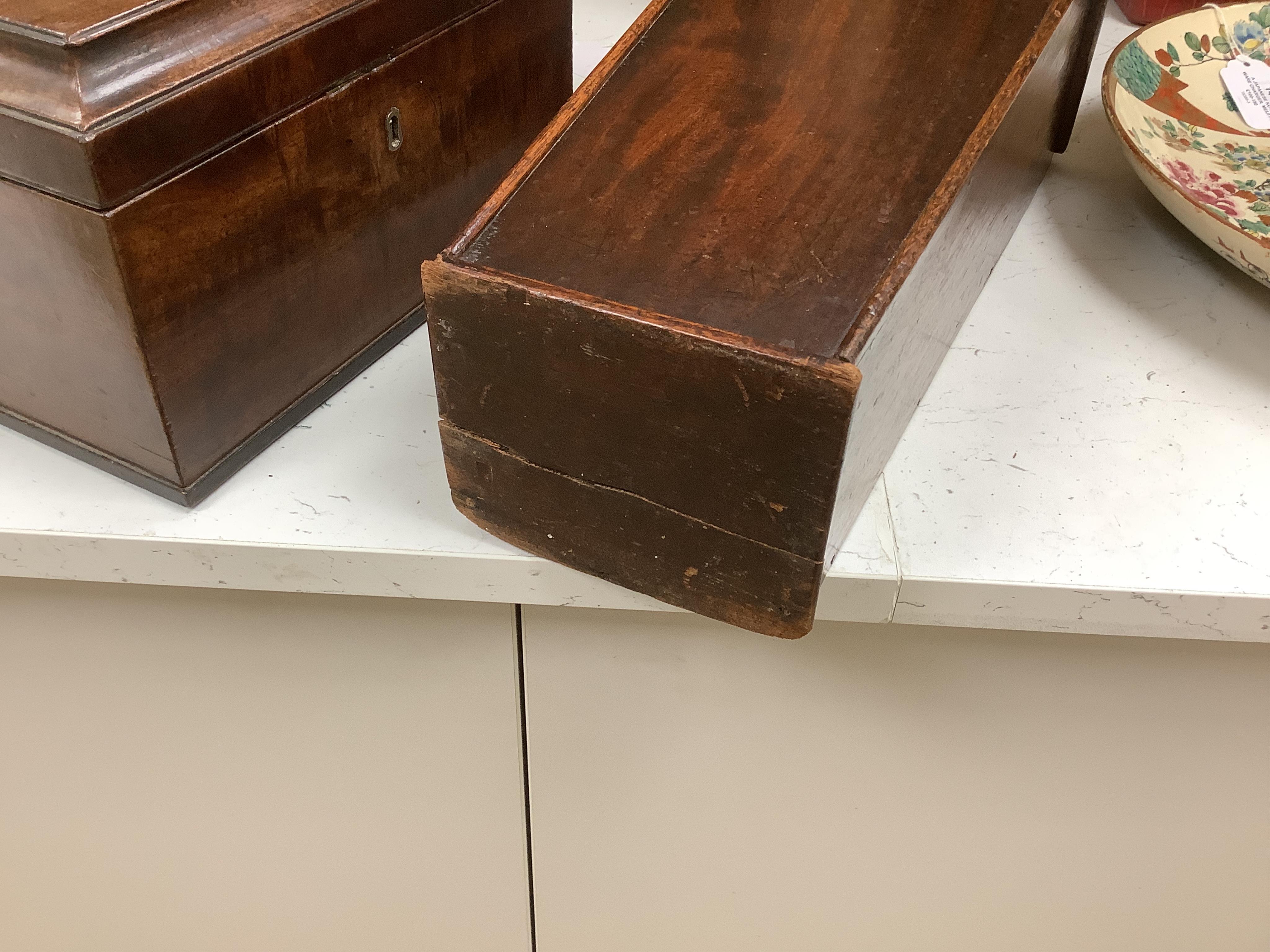 A late 18th century mahogany tea caddy and a similar candle box, 52cm. Condition - fair